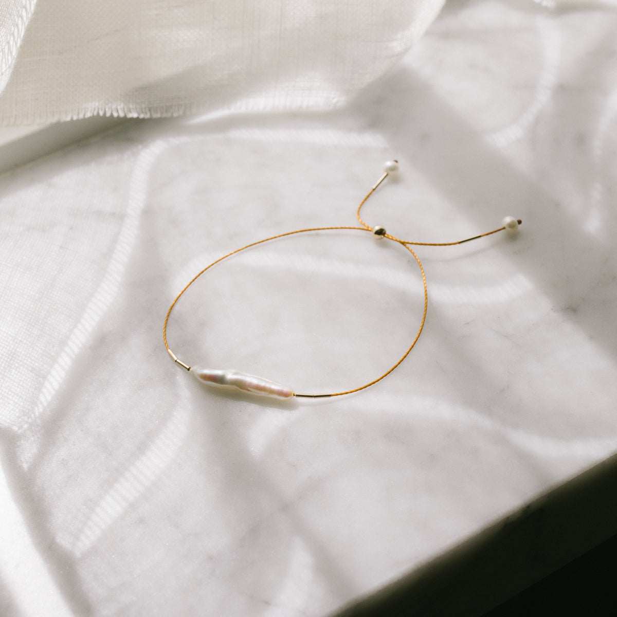 Finger Pearl Bracelet by Anchovy