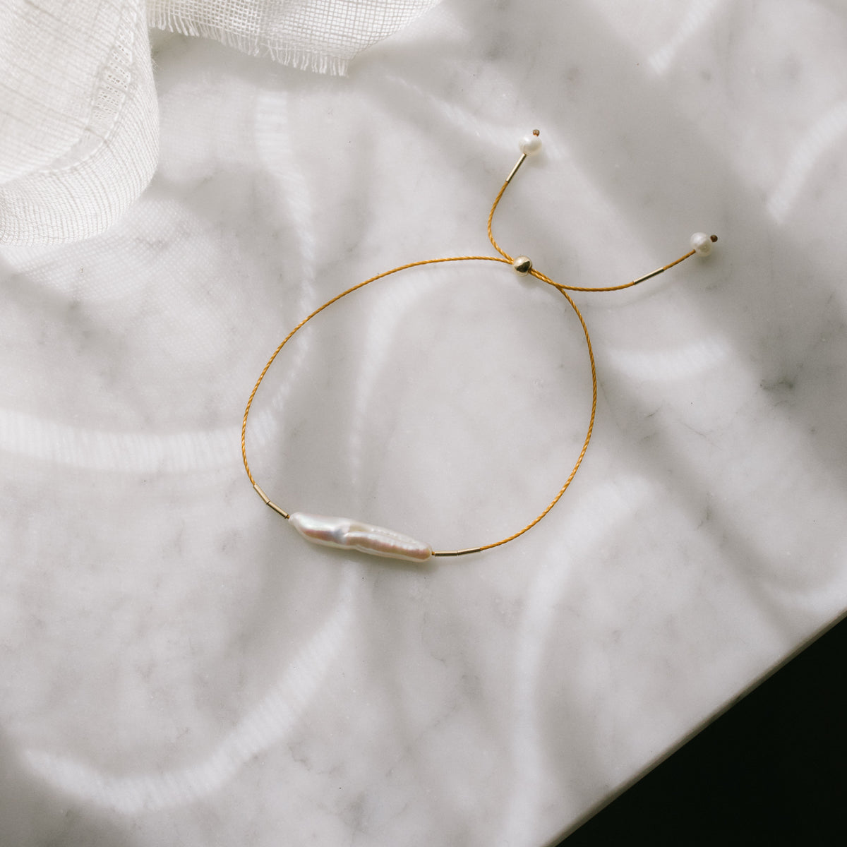 Finger Pearl Bracelet by Anchovy